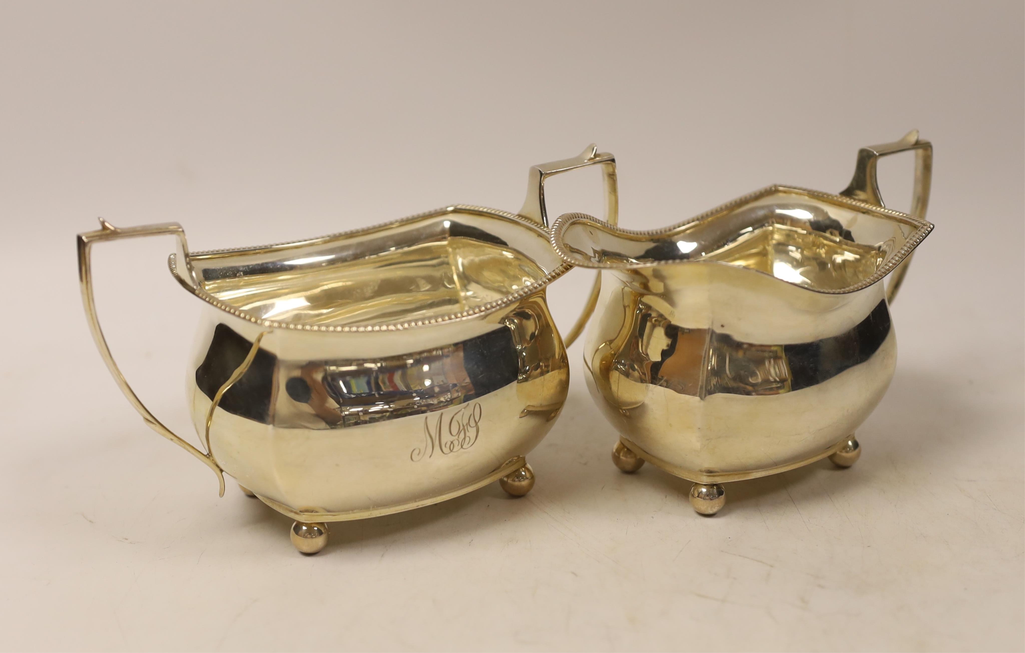 A George V silver sugar bowl and a cream jug, S. Blanckensee & Son Ltd, Chester, 1930, 11.1oz.